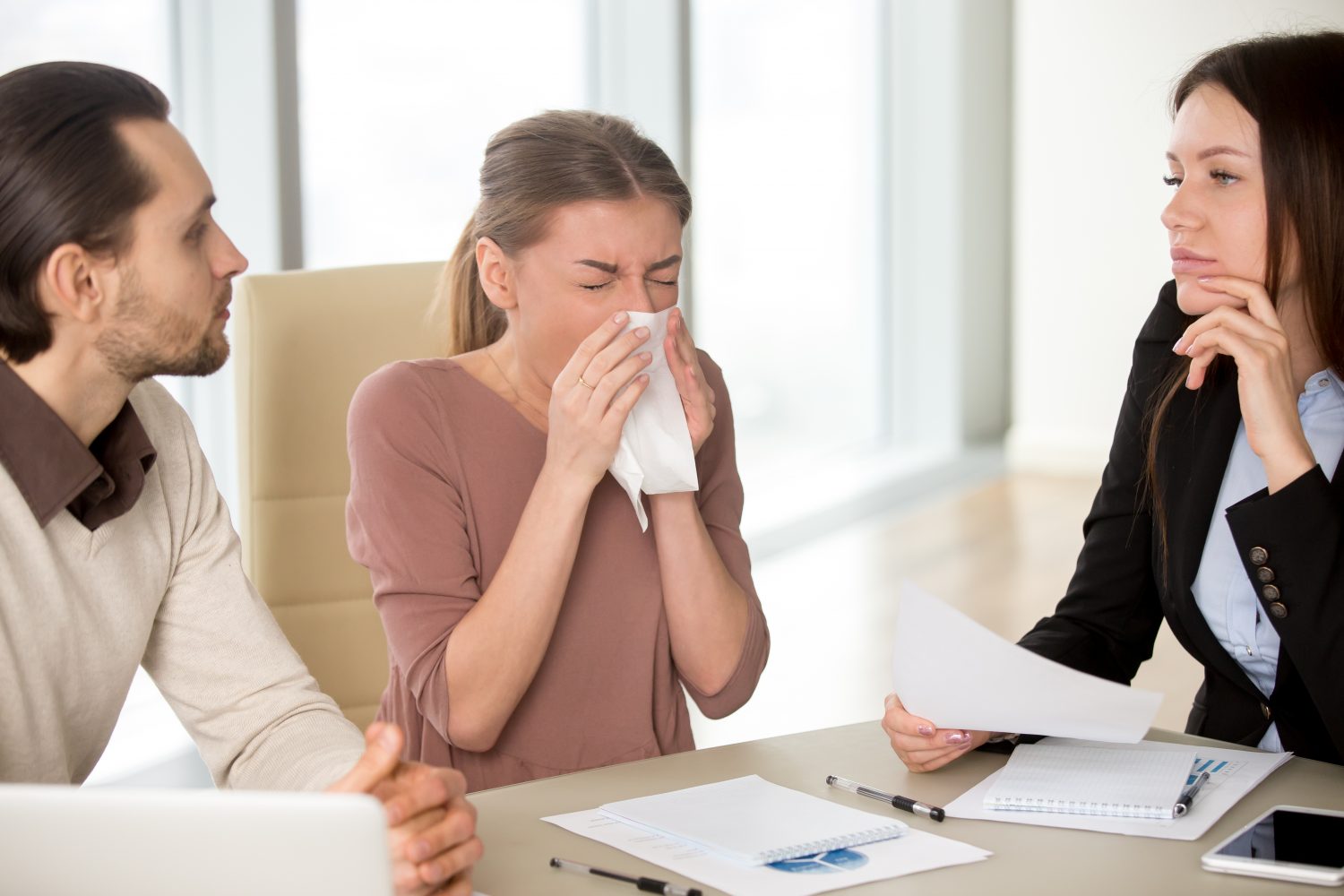 Coworker sneezing