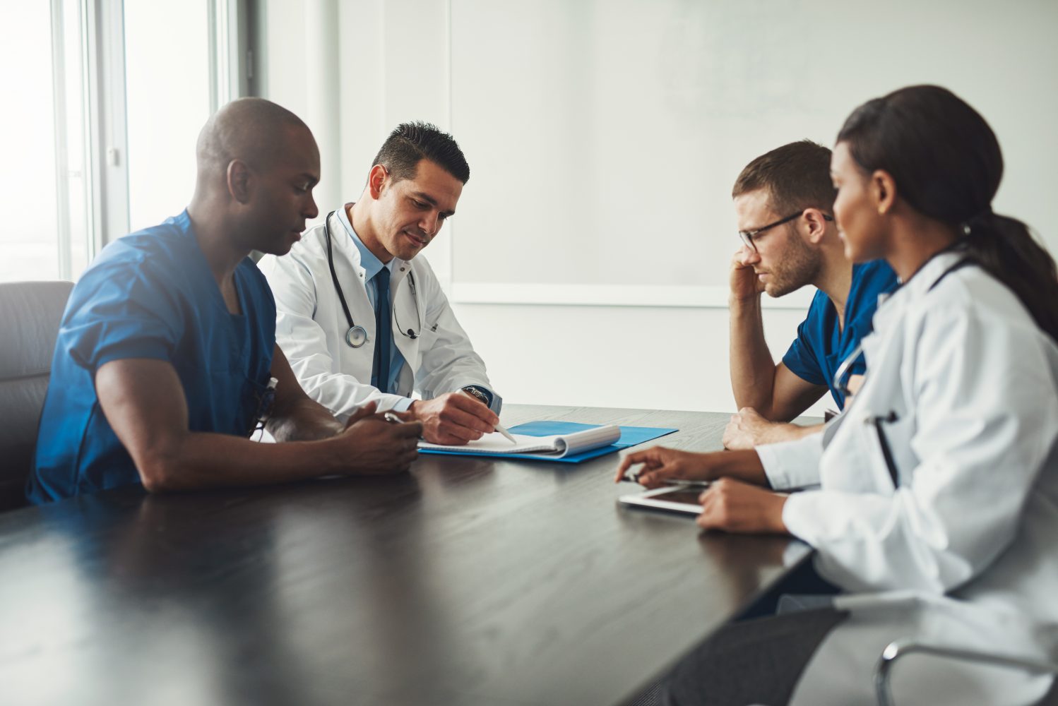 Doctors sitting at table